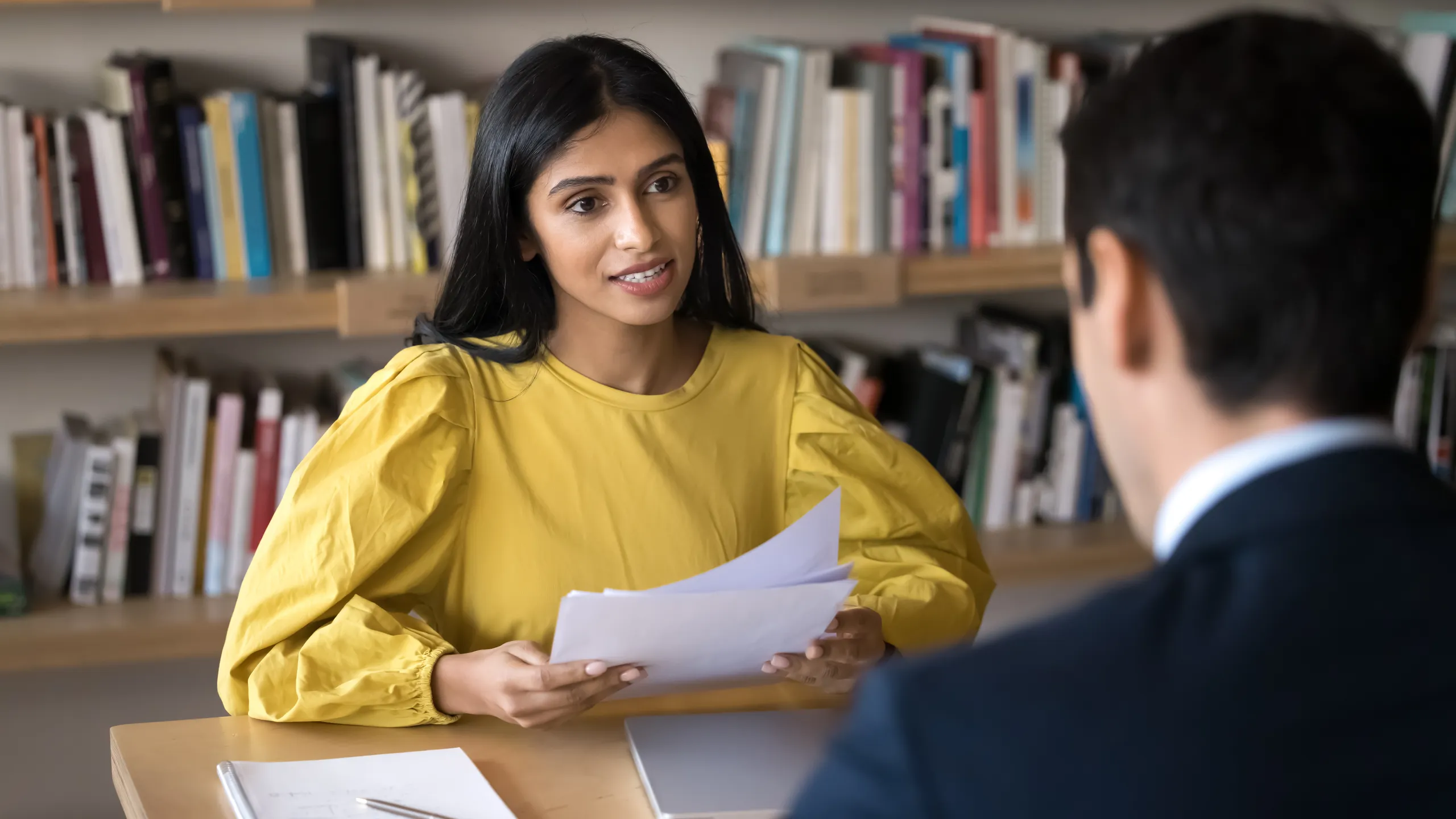 Young Indian recruit manager woman talking to job candidate