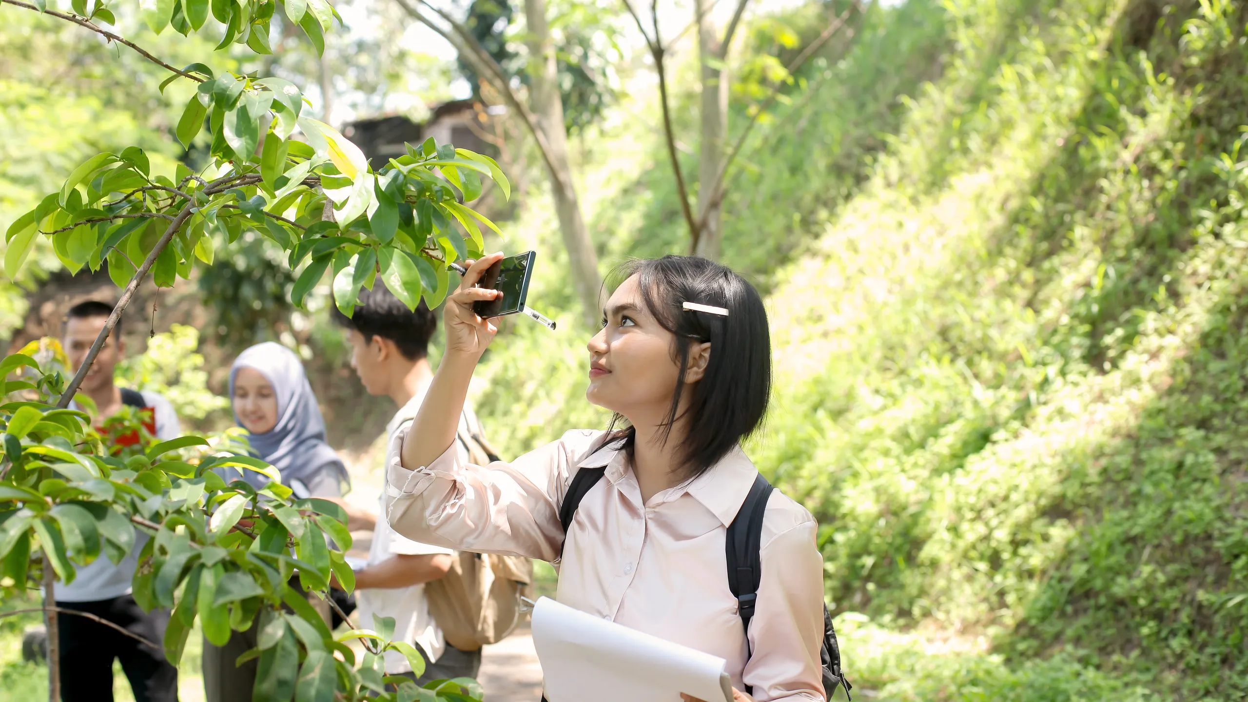 Asian Girl Student Learning And Exploring Nature With Smartphone