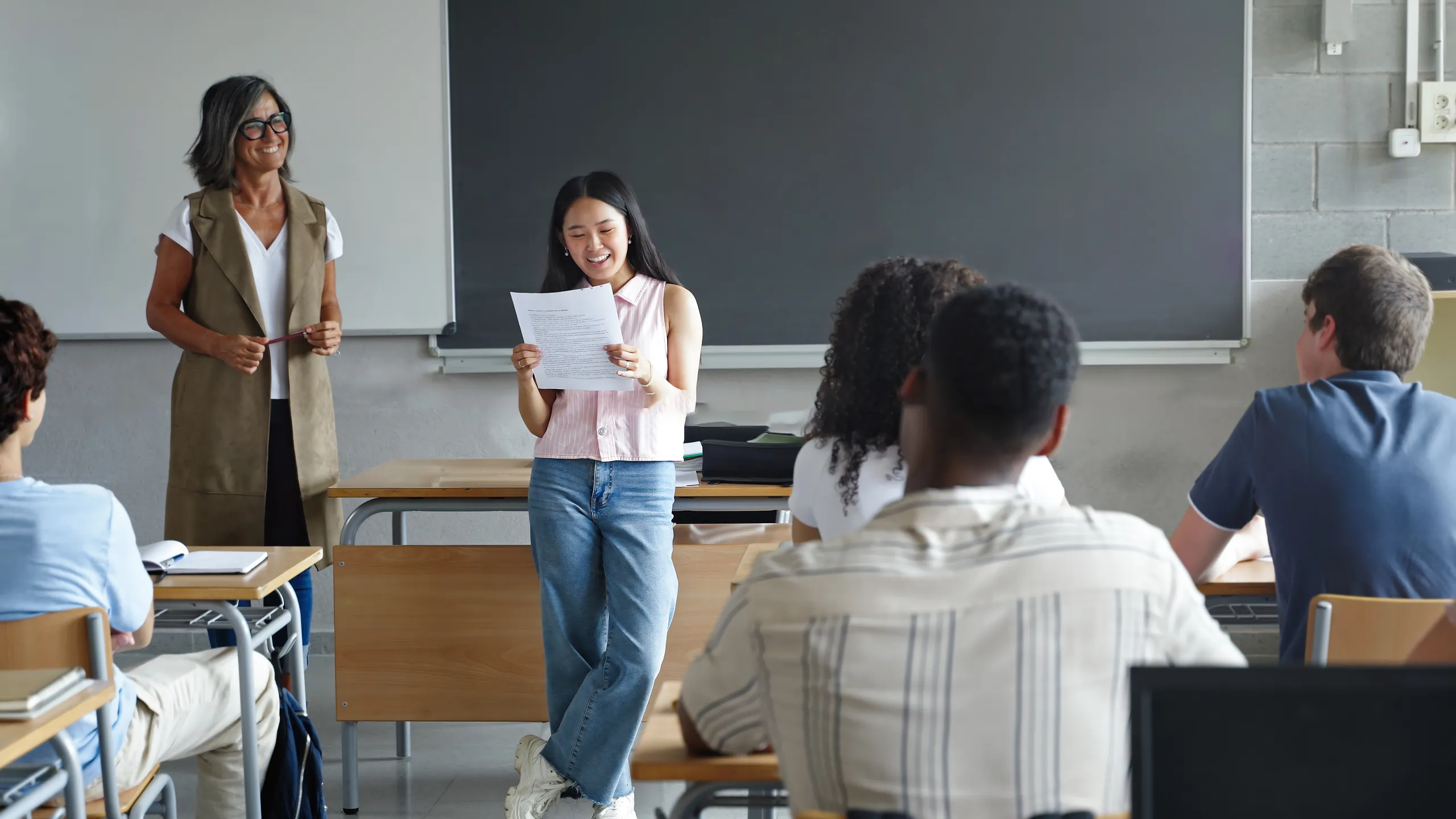 High school student club leadership talks in a class meeting