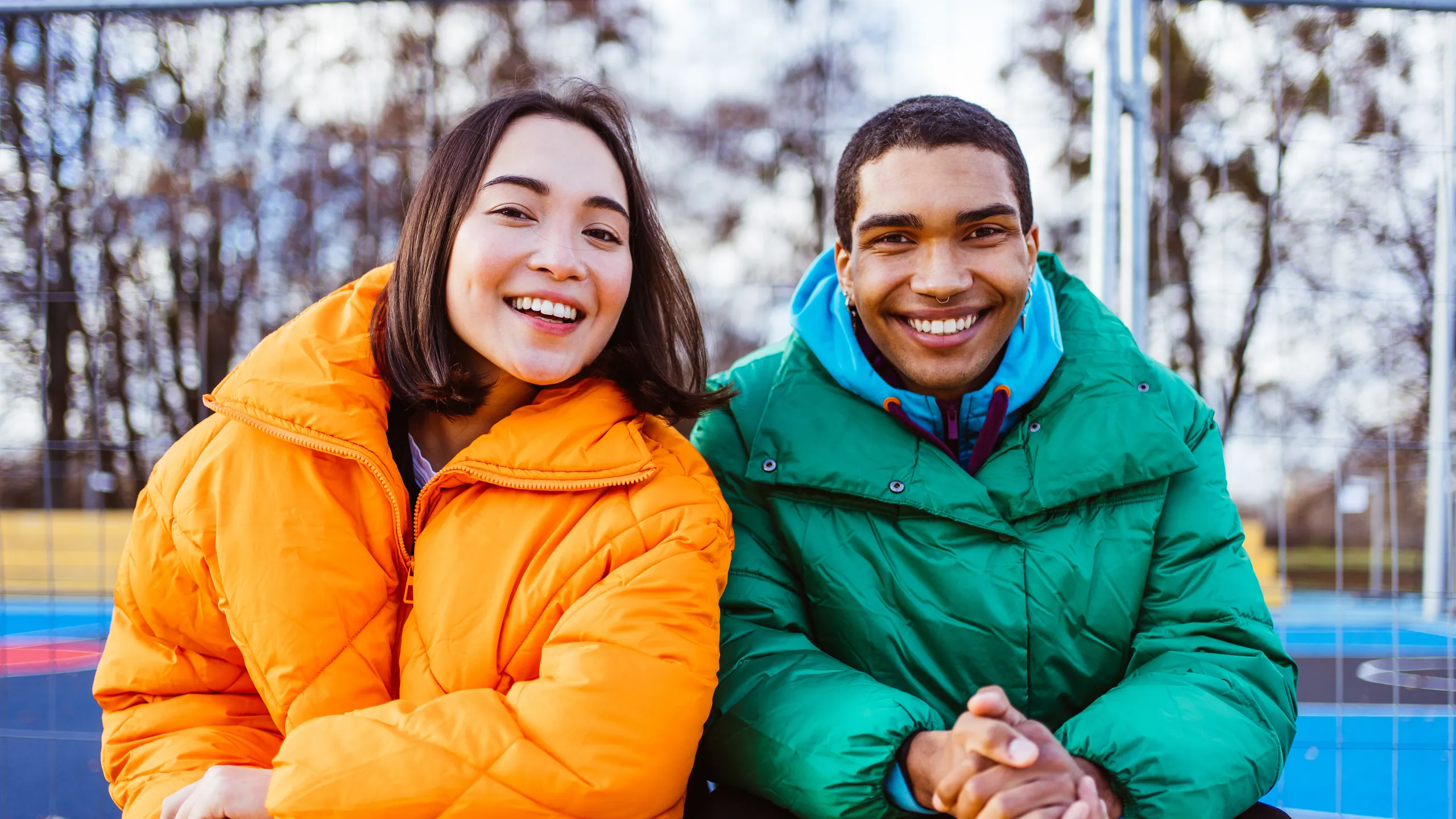 Multiracial young couple of lovers dating outdoors in winter