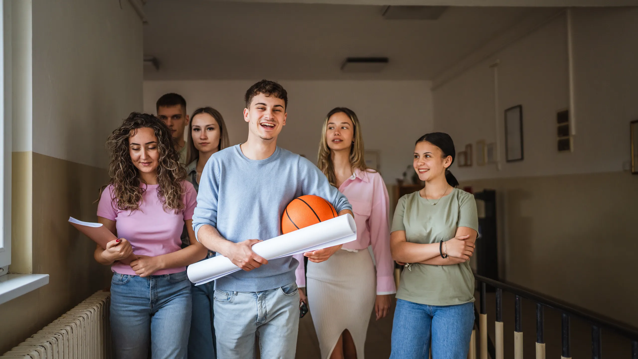 young man student go to class with his classmates in the background