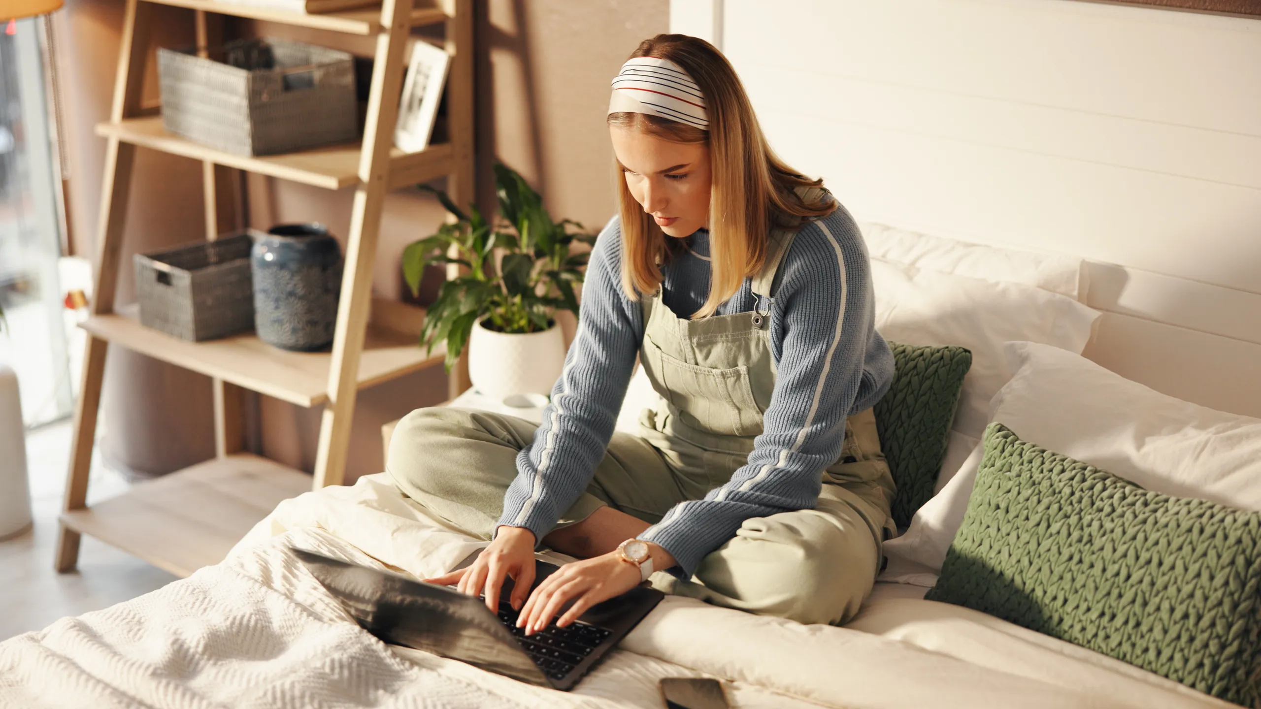 Woman, student or typing on laptop on bed for online education, check exam results or writing email. Above, girl and tech in home for scholarship application, thesis research and weekend productivity