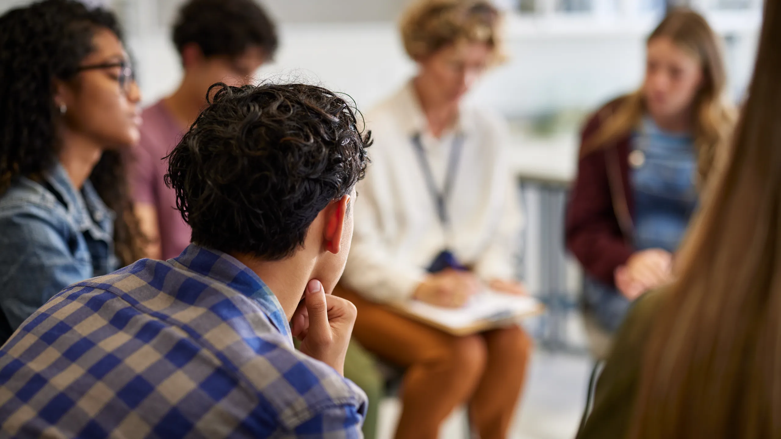 Counseling group session with teens at school