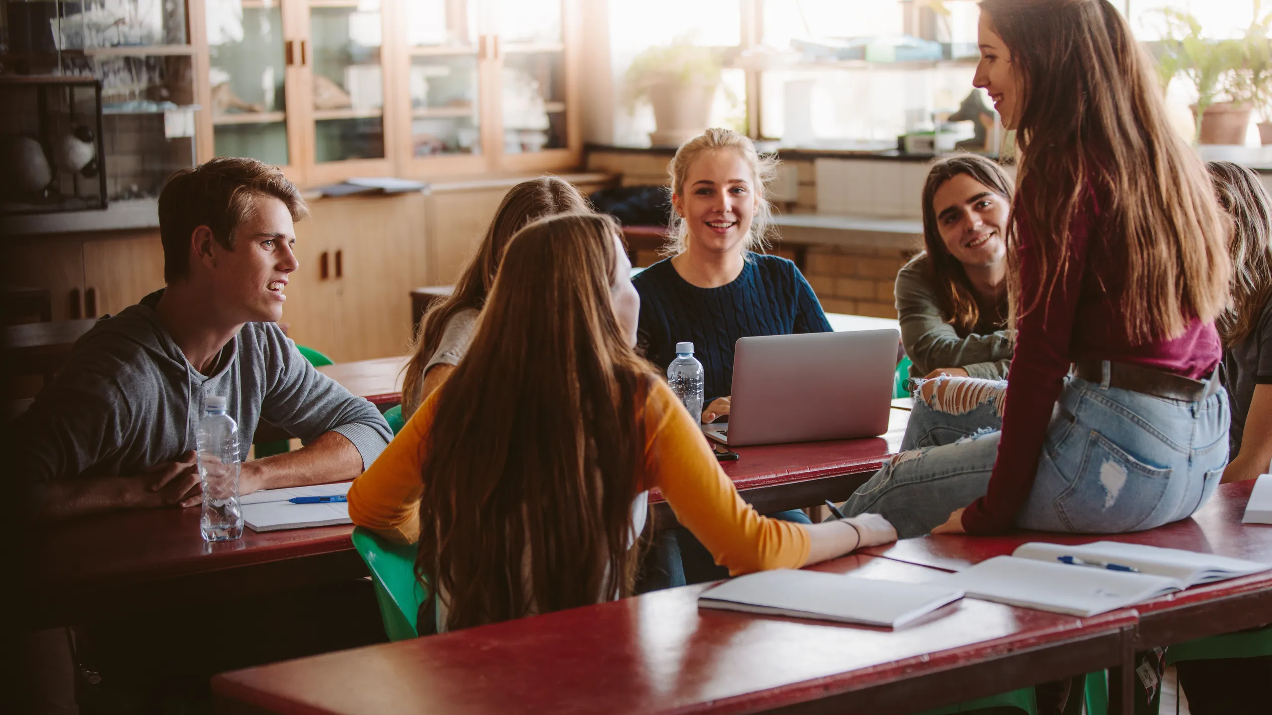 University students chatting during break in class