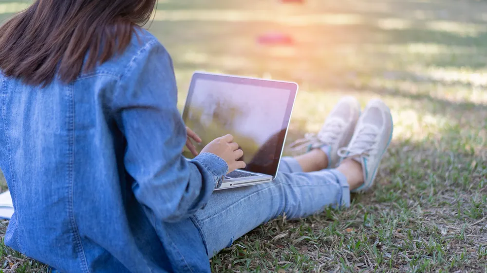 Education study abroad,Asian student girl with glasses look at laptop while doing homework making video call abroad using internet friend connection, business women use computer analysis finance data