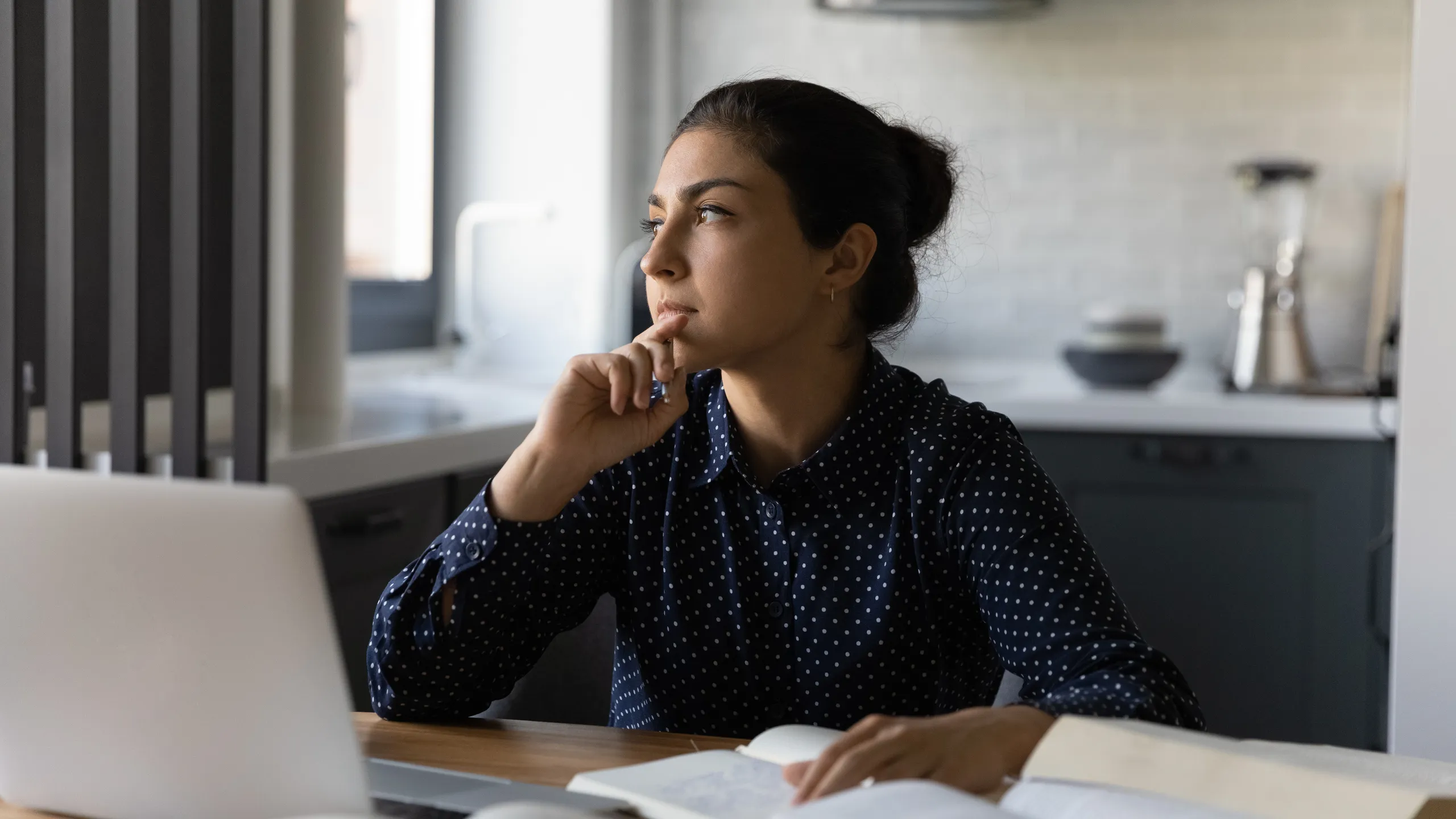 Pensive Indian woman study online at home thinking