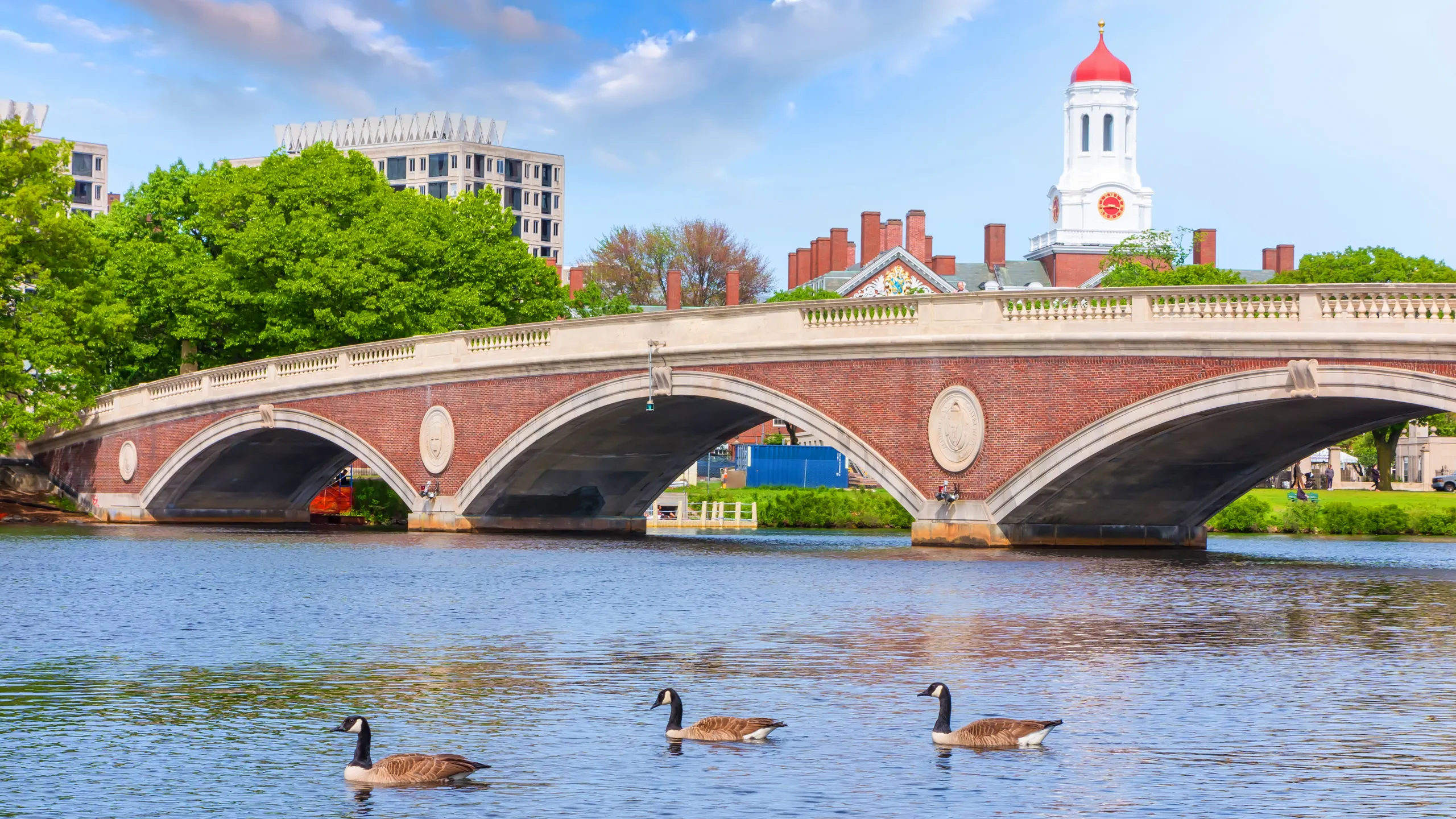 Vintage Bridge with clock tower over Charles River near Harvard University campus Boston