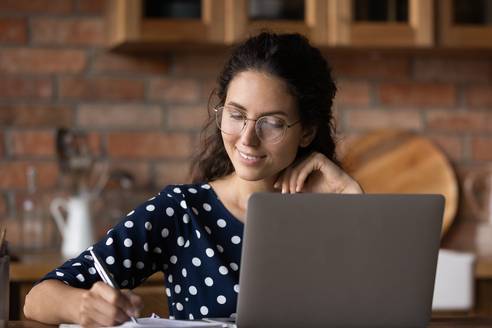 Confident young latin woman student take test exam by laptop