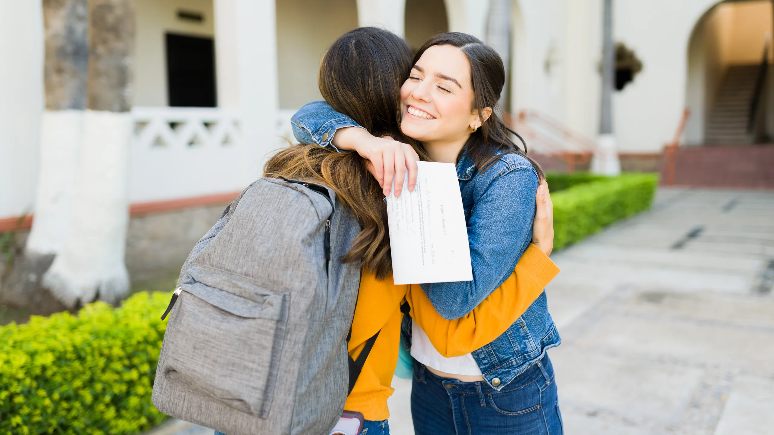 Passing her exams with good grades