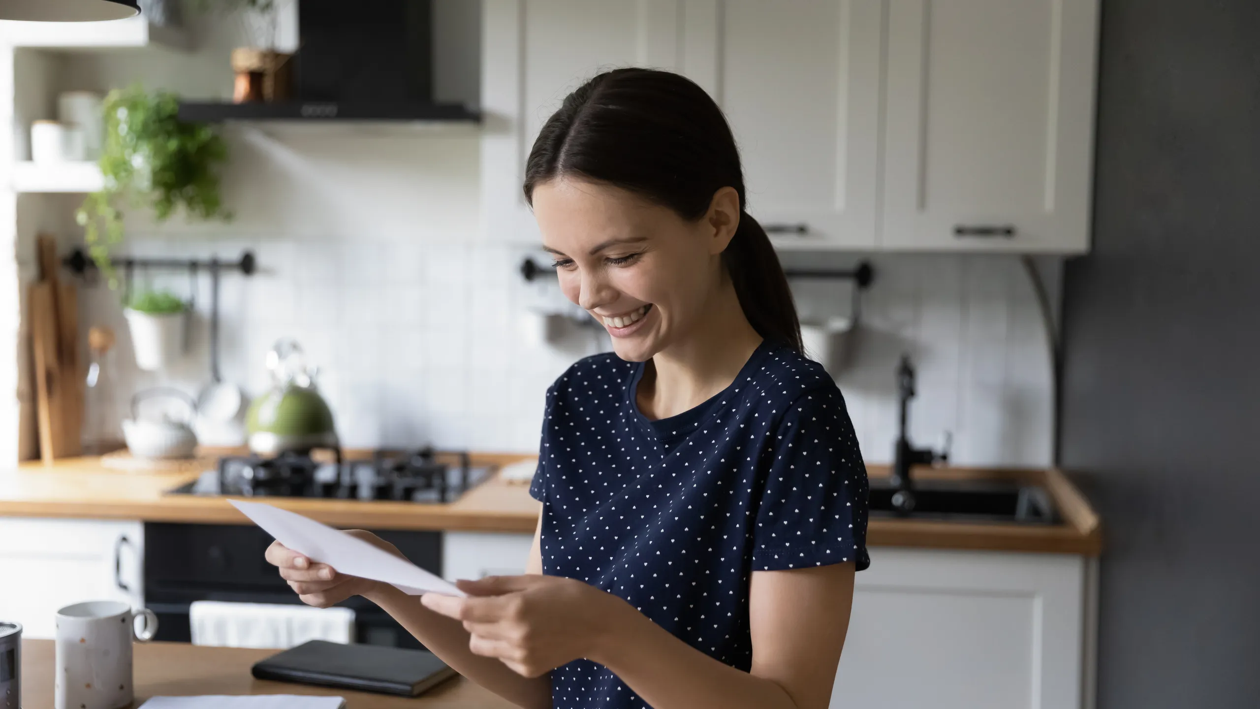 Cheerful happy student girl reading document, receiving letter from college