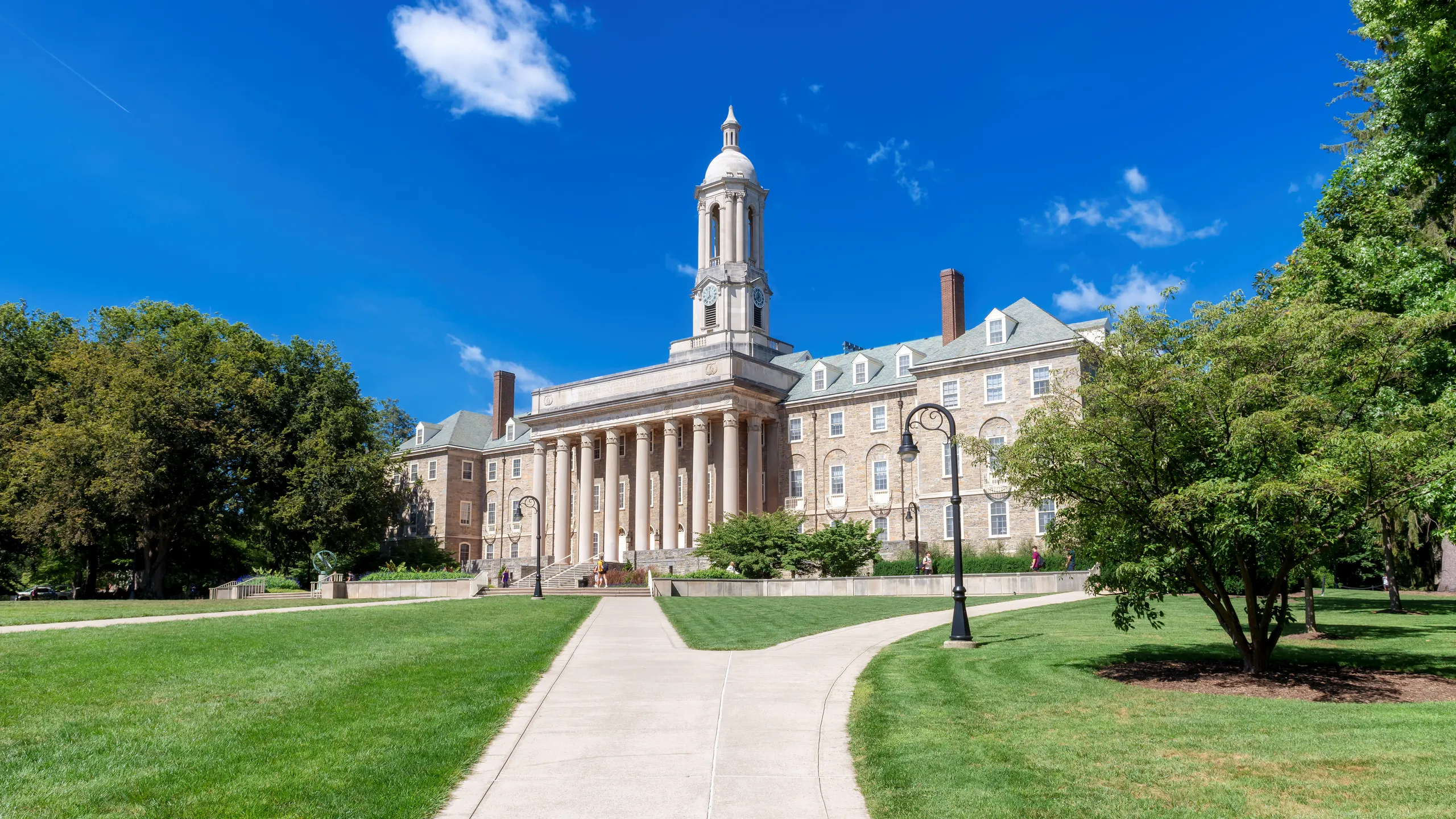 The Old Main building on the campus of Penn State University in spring sunny day, State College, Pennsylvania.