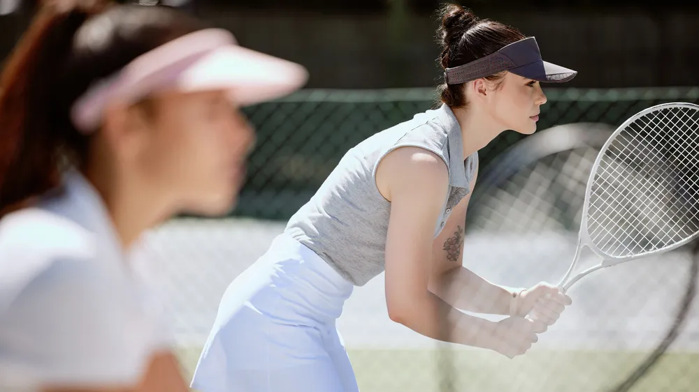Focus, tennis and team of women in court for competition, game or training outdoor with challenge, teamwork and goal strategy. Fitness, sports and club for athlete people with tennis court motivation