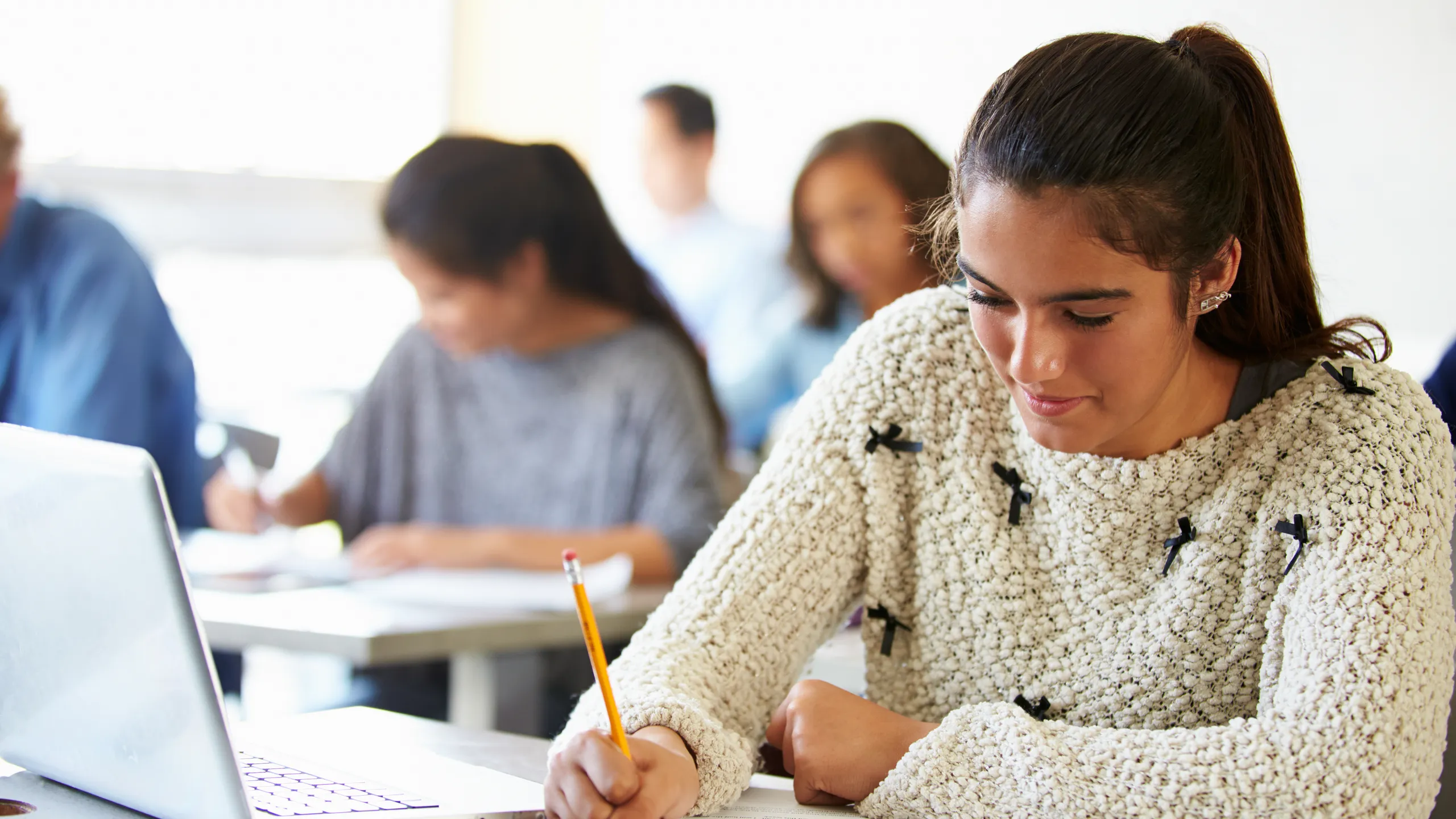 High School Students In Class Using Laptops