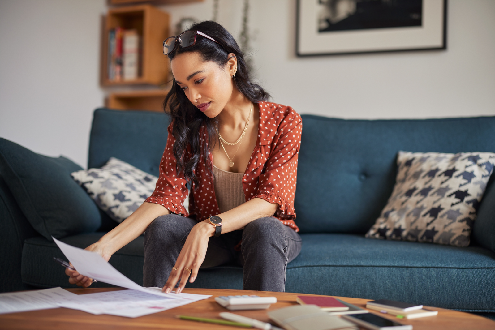Student reviewing loan paperwork at home