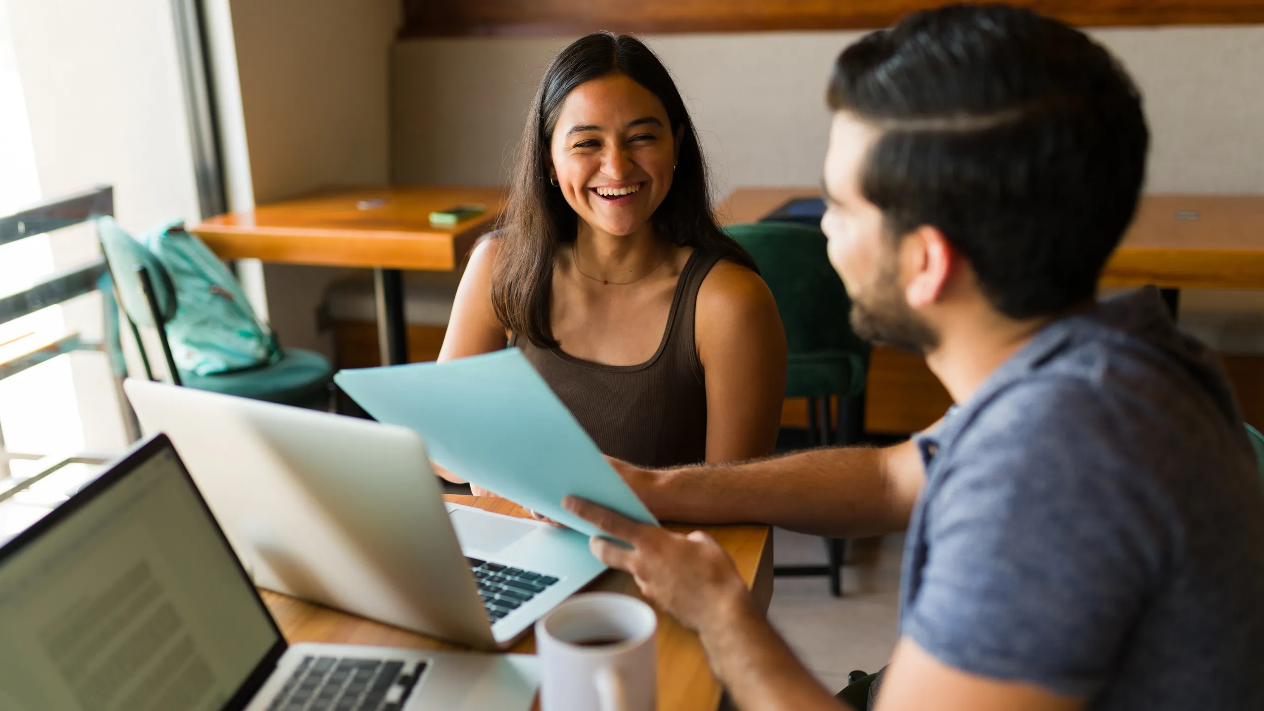 Cheerful woman and man working as a teamwork