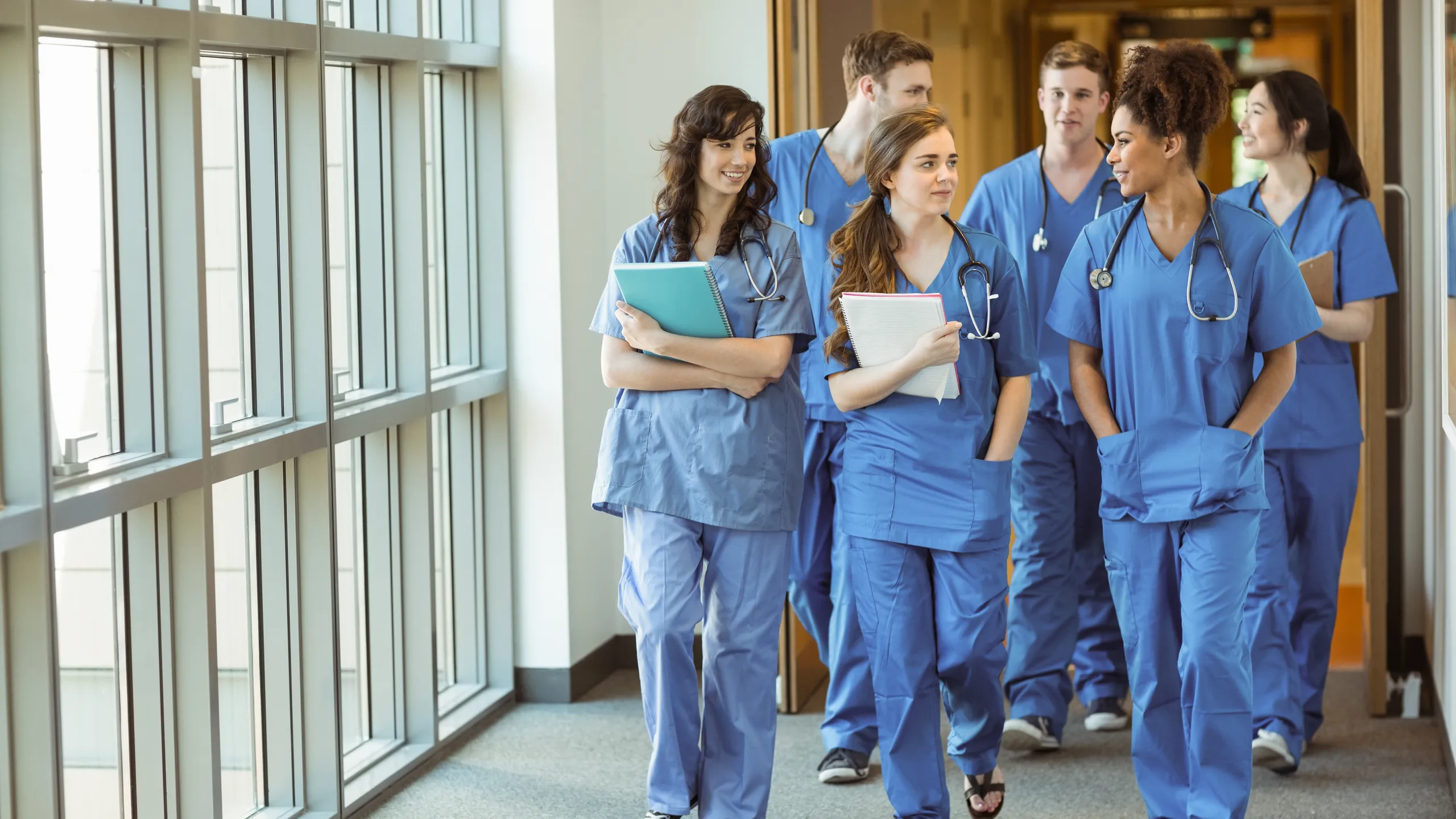 Medical students walking through corridor