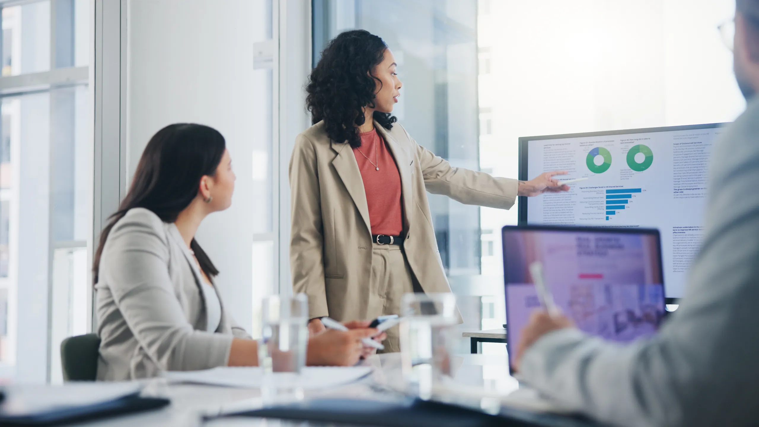 Data analysis, business meeting or woman with graph presentation in office for revenue, profit or sale statistics. Chart, analytics or accounting mentor brainstorming economy, inflation or solution
