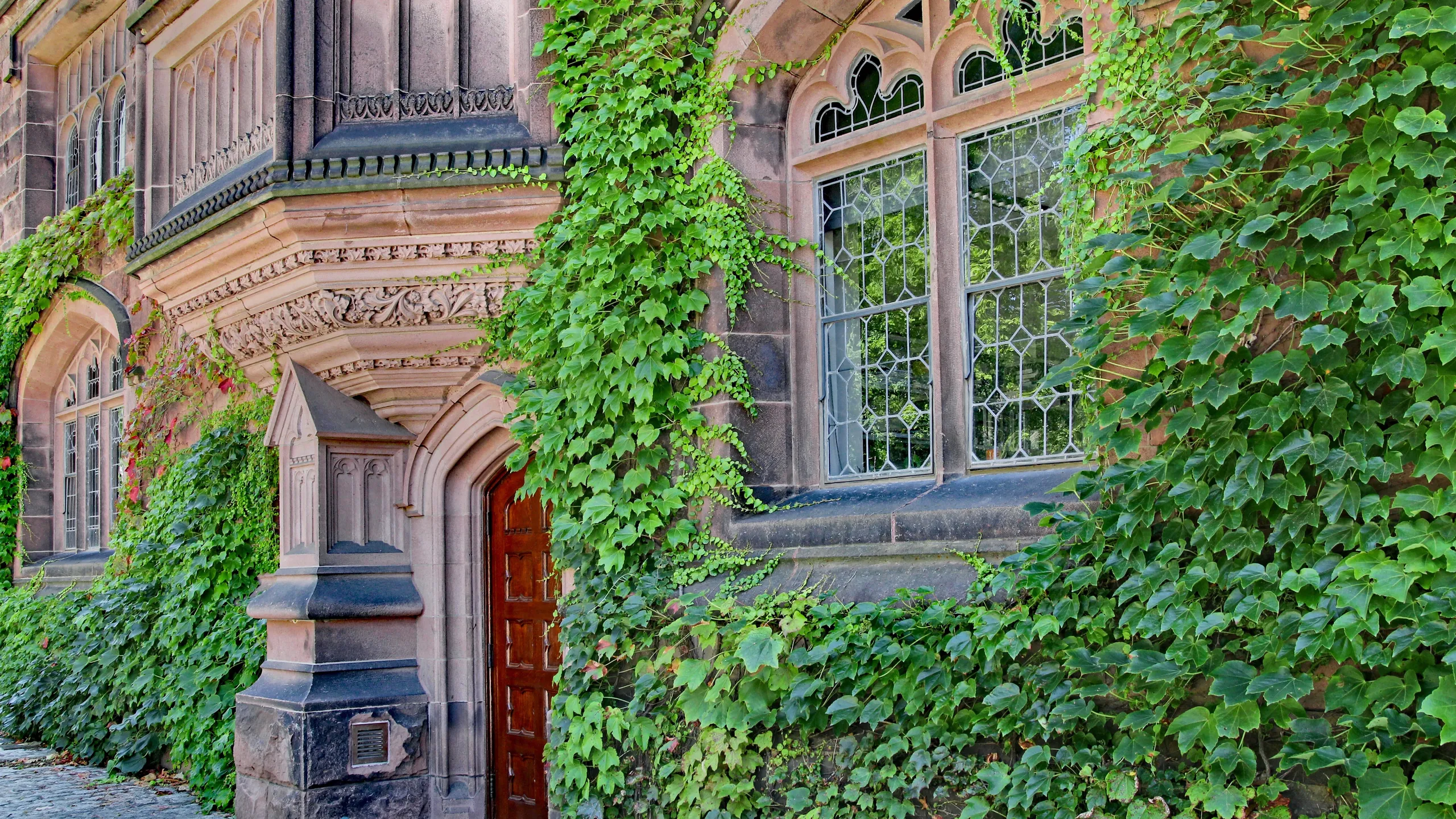 Princeton University's spacious campus has elegant stone-clad buildings such as Pyne Hall, with intricate carving in its pink sandstone.