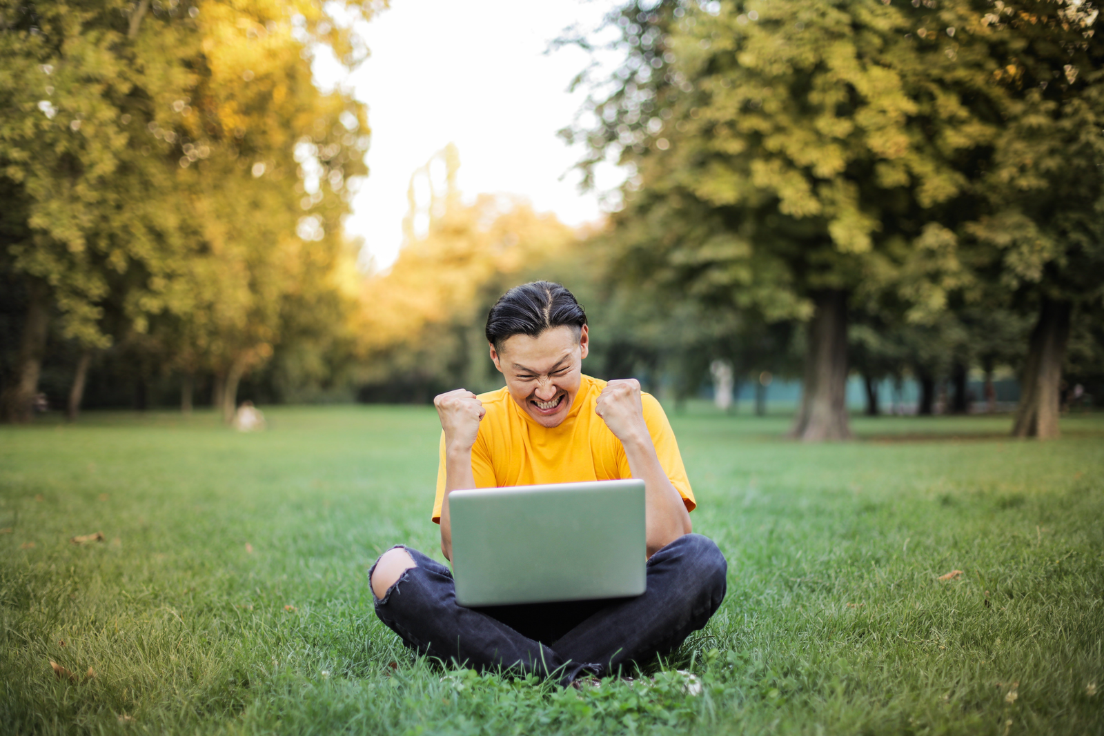 man-sitting-on-a-green-grass-field-3761504