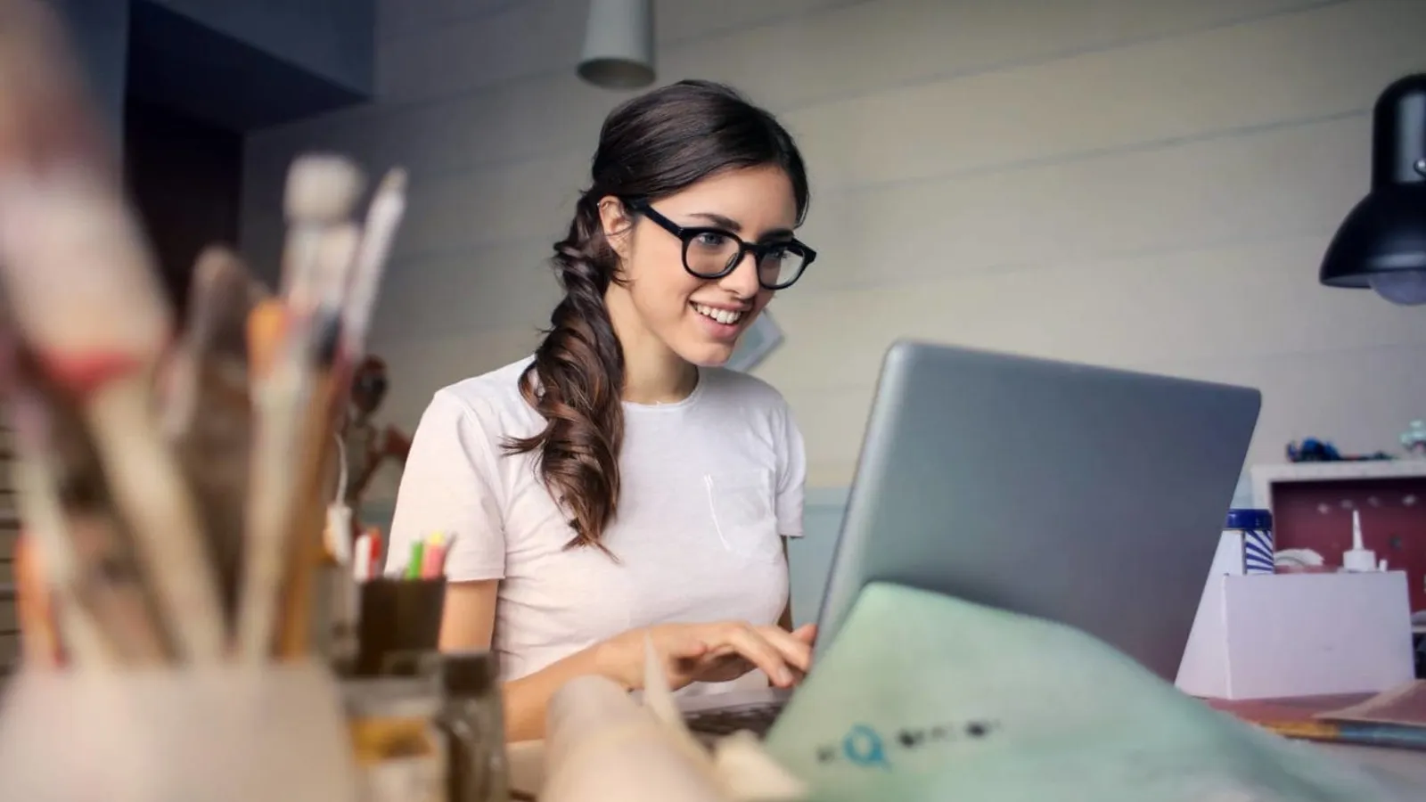 photo of woman using her laptop