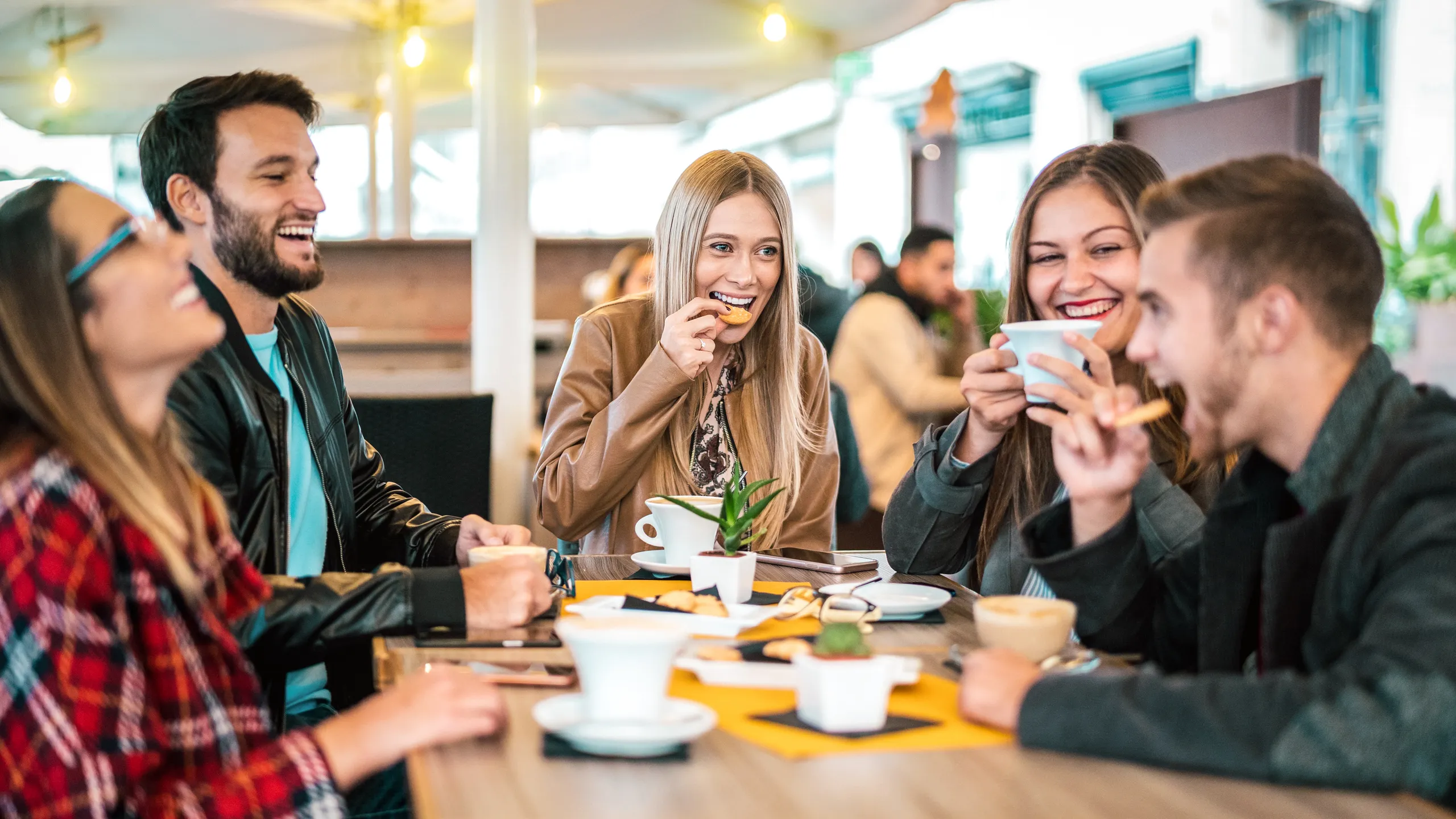 students chatting in coffee shop