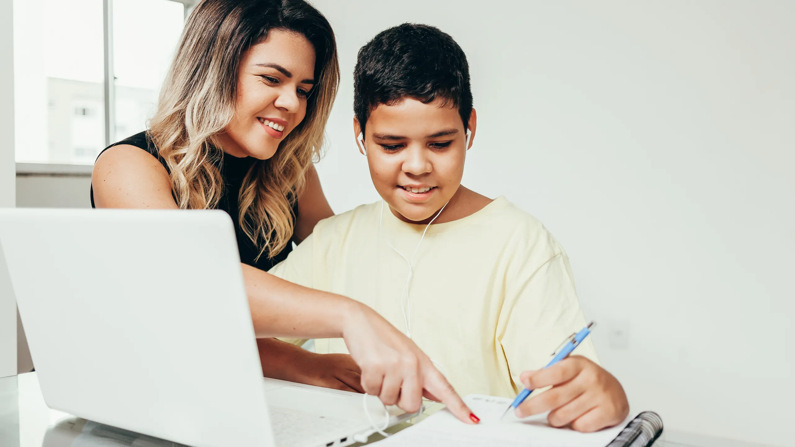 young student working at home with parent