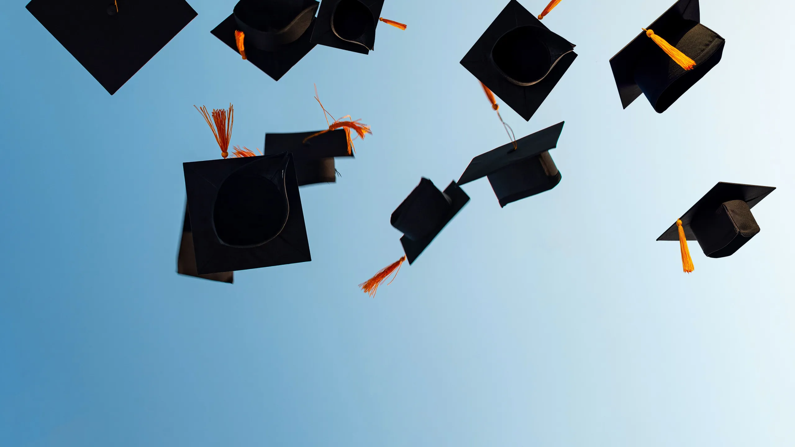Graduates,Throw,Black,Hats,In,The,Sky.