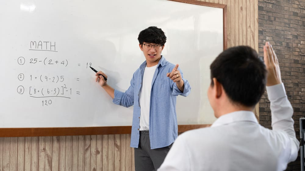 teacher explaining math to student