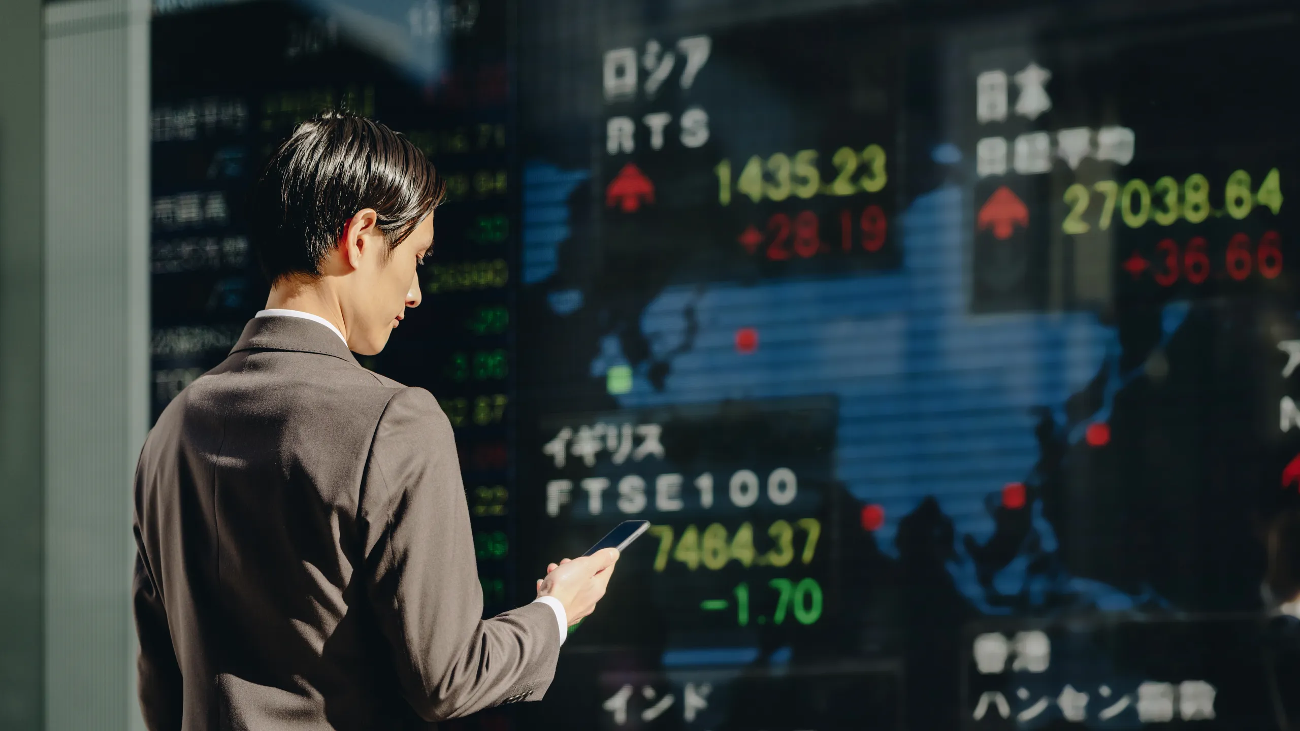 man looking at the market conditions