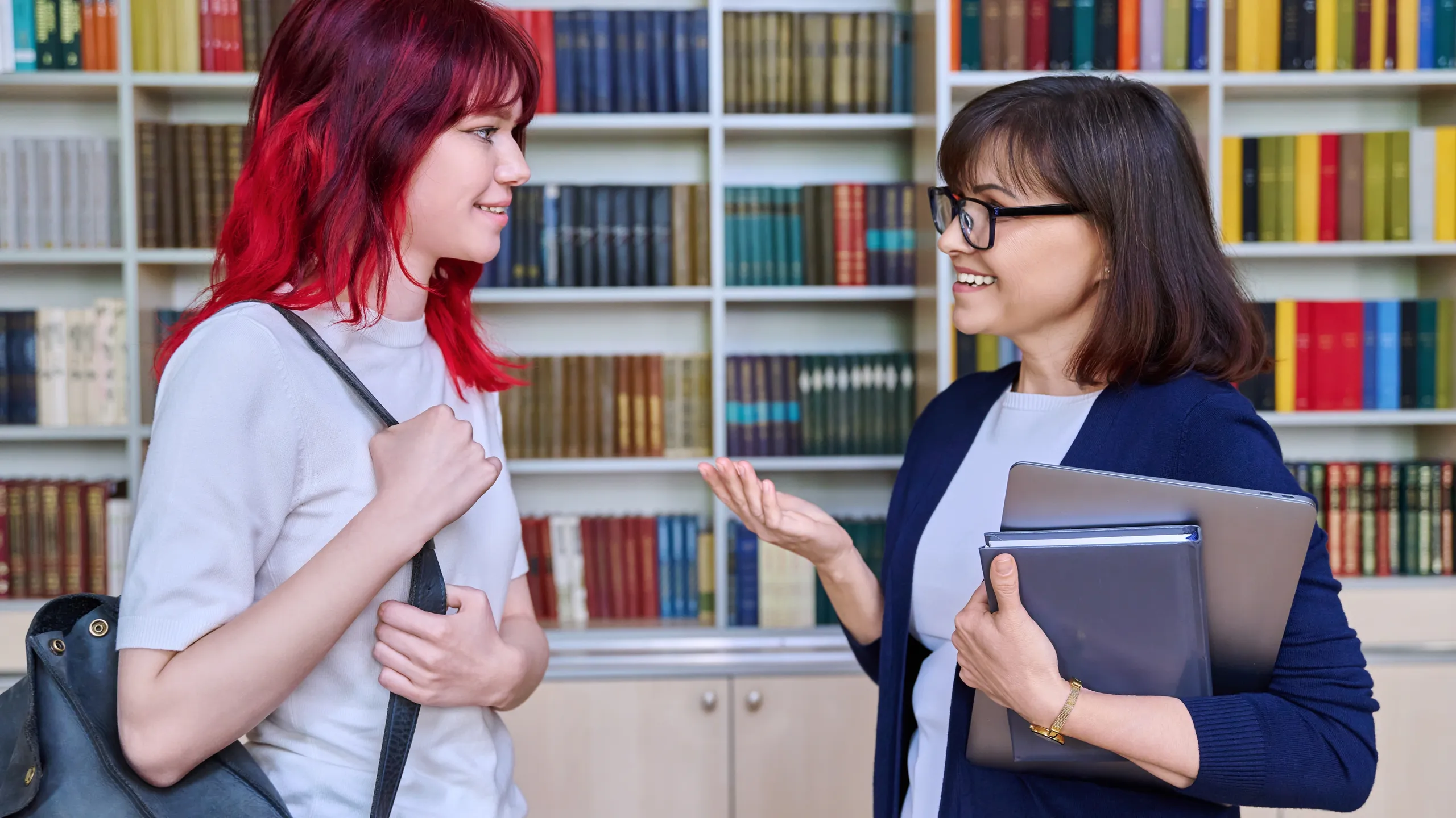 teacher talking to student