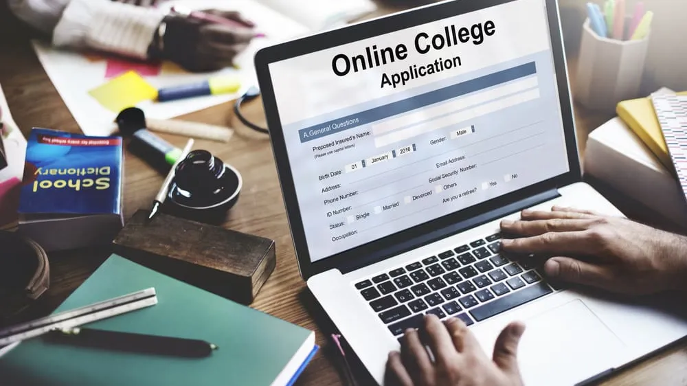 Student looking at college application components