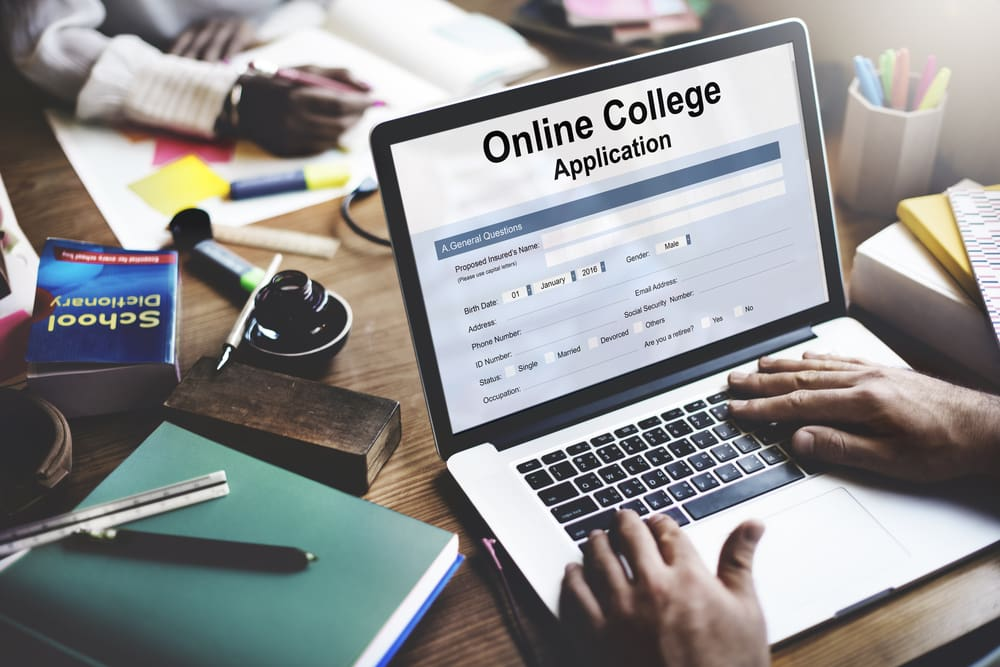 Student looking at college application components
