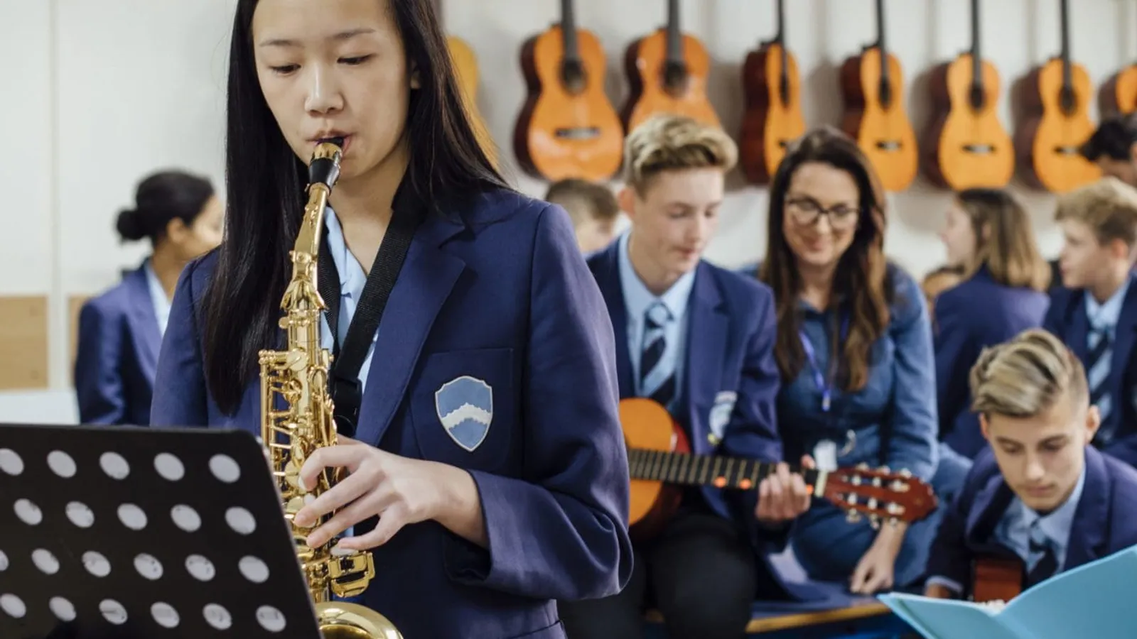 student playing music