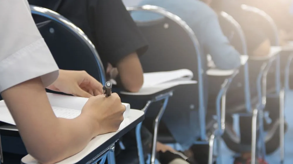 college students writing in exam