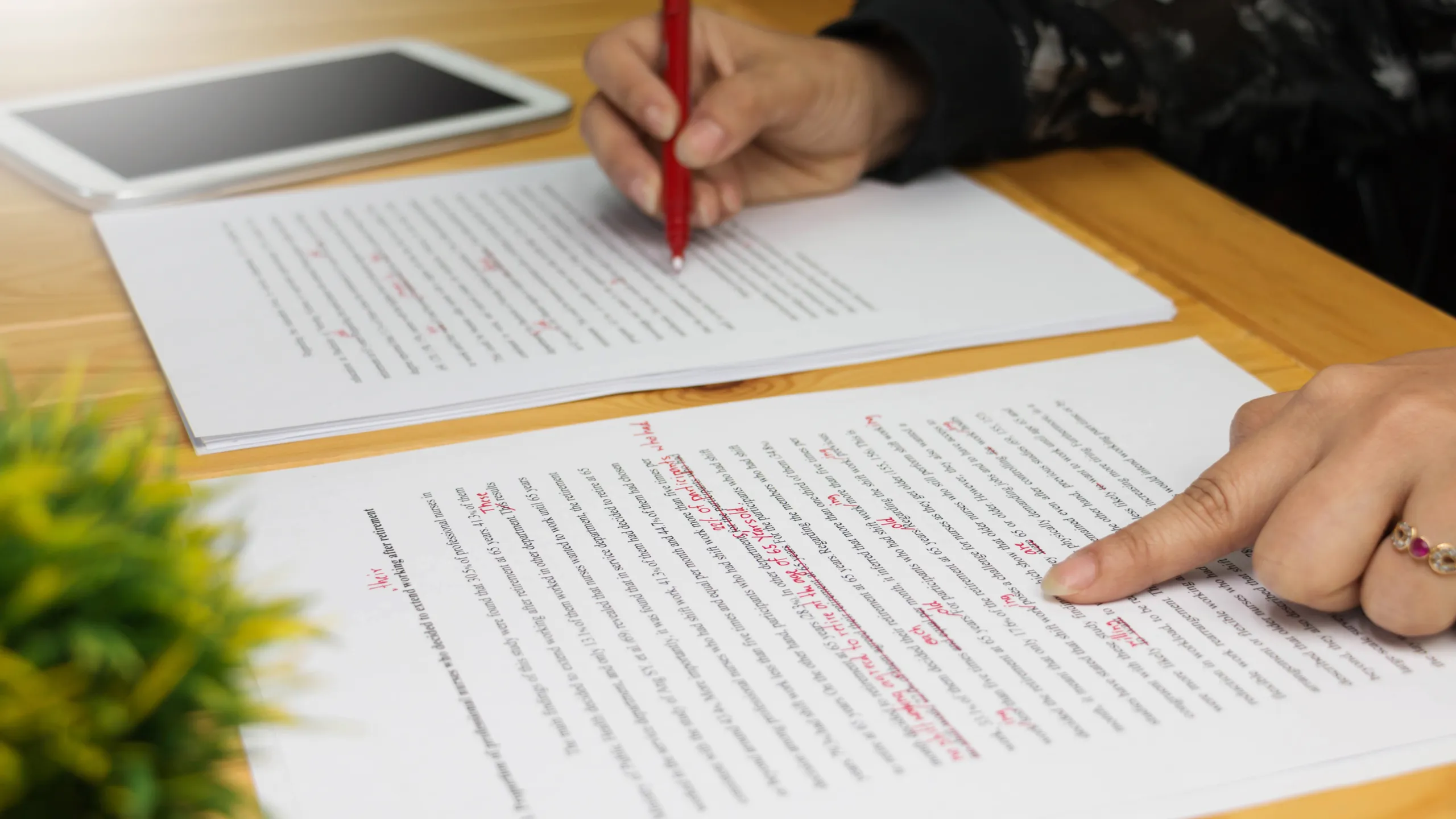 Hand,Working,On,Paper,For,Proofreading