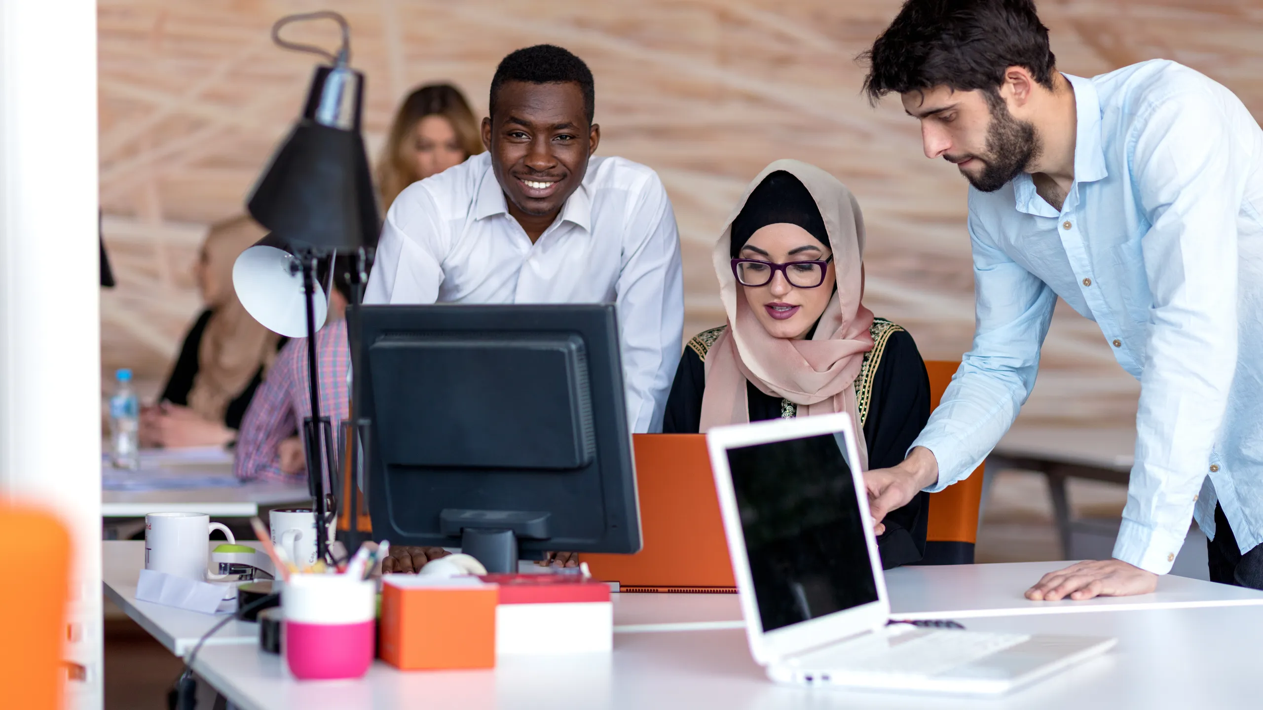 diverse students using laptop
